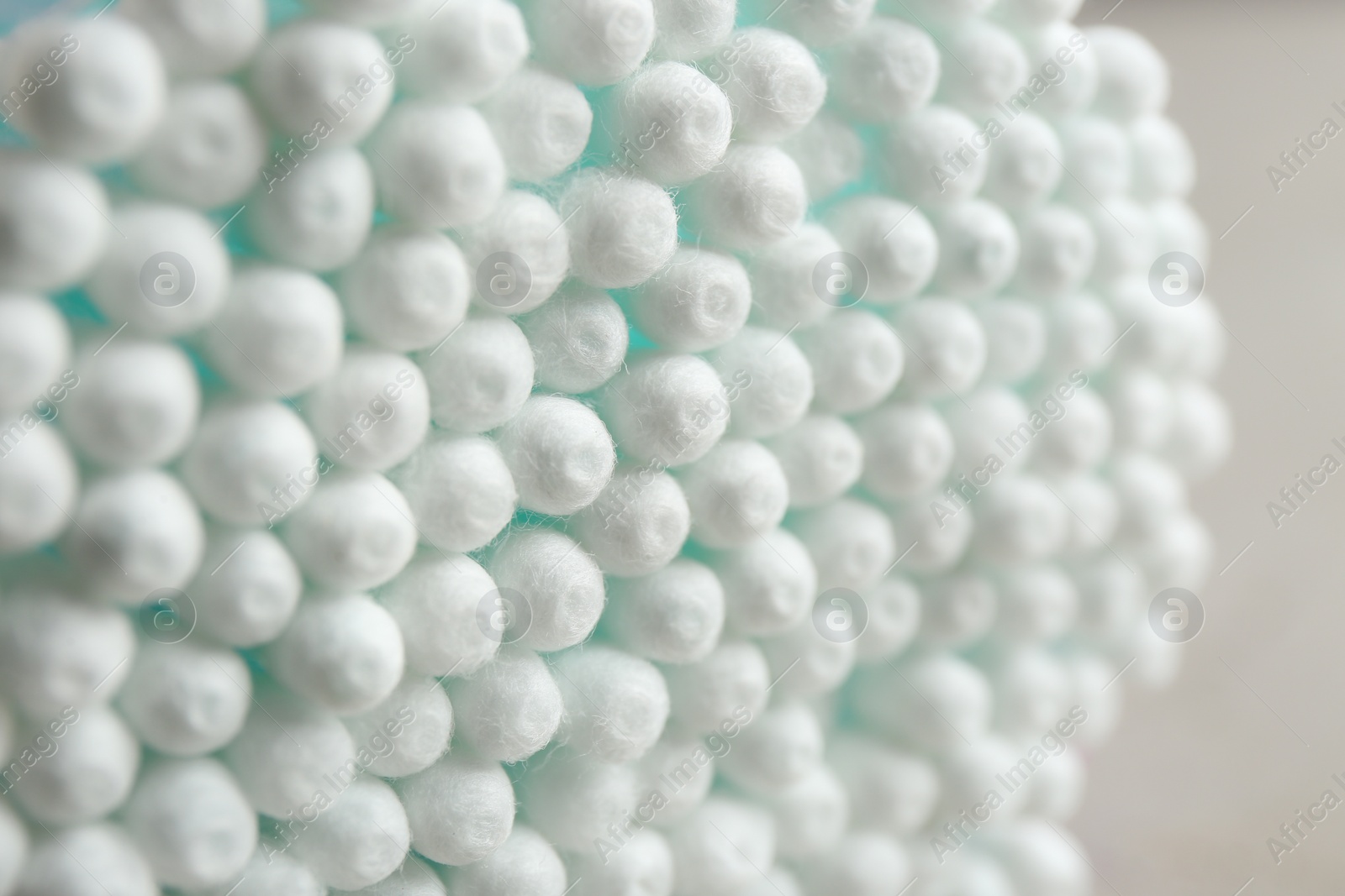 Photo of Many cotton swabs on grey background, closeup