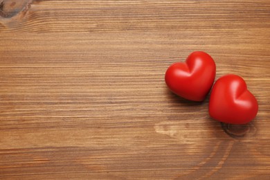 Photo of Red hearts on wooden background, flat lay with space for text. Happy Valentine's Day