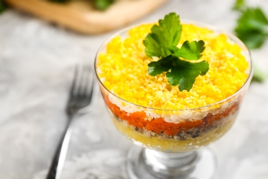 Traditional russian salad Mimosa on table, closeup