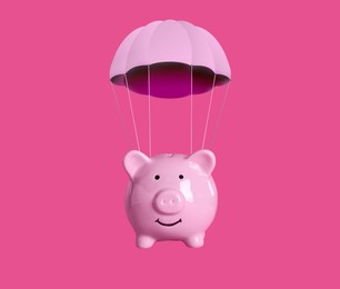 Image of Cute piggy bank with parachute flying on pink background