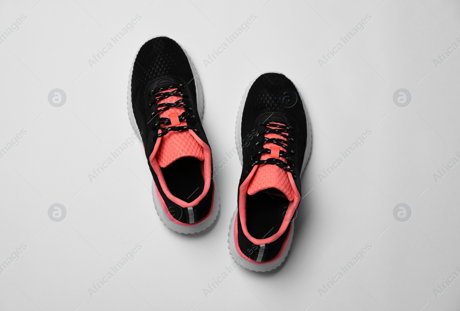 Photo of Pair of stylish sport shoes on white background, flat lay