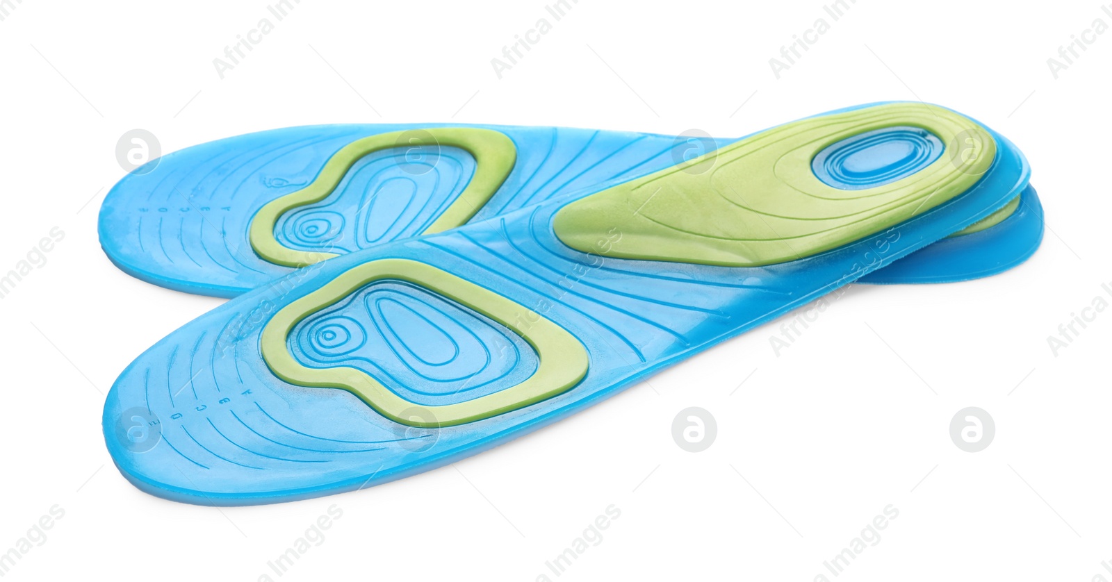 Photo of Light blue orthopedic insoles isolated on white