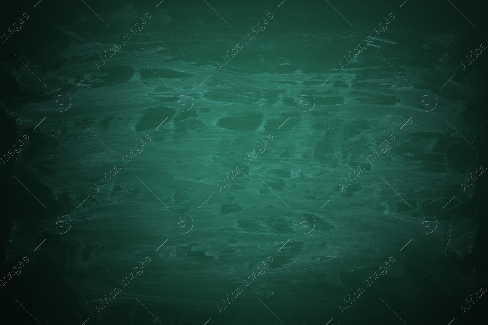 Image of Dirty green chalkboard as background. Vignette effect