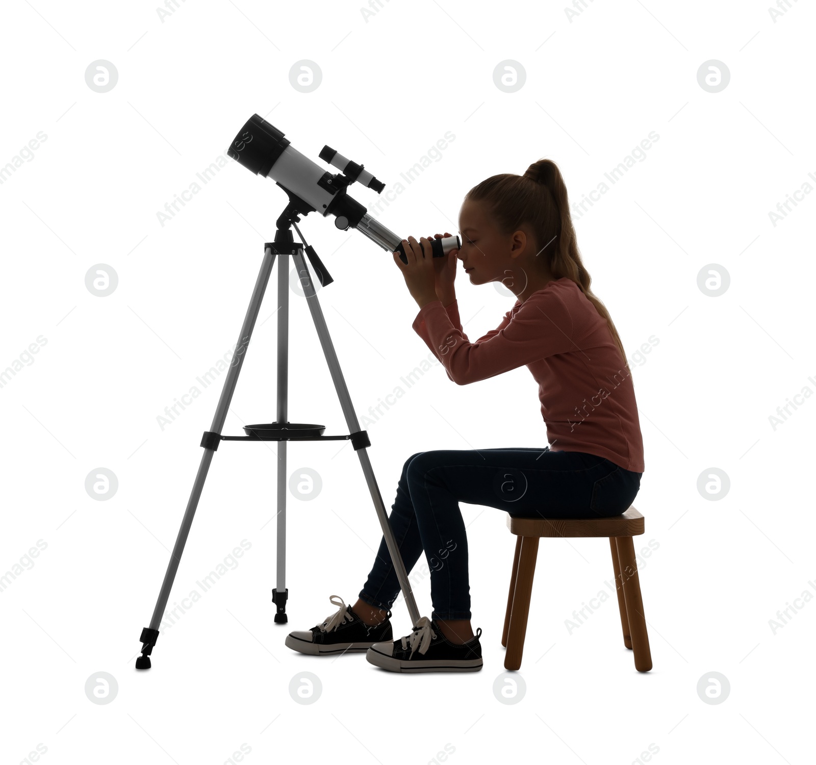 Photo of Cute little girl looking at stars through telescope on white background