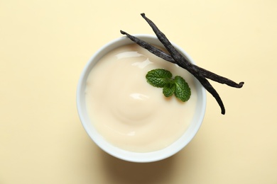 Vanilla pudding, sticks and fresh mint on color background