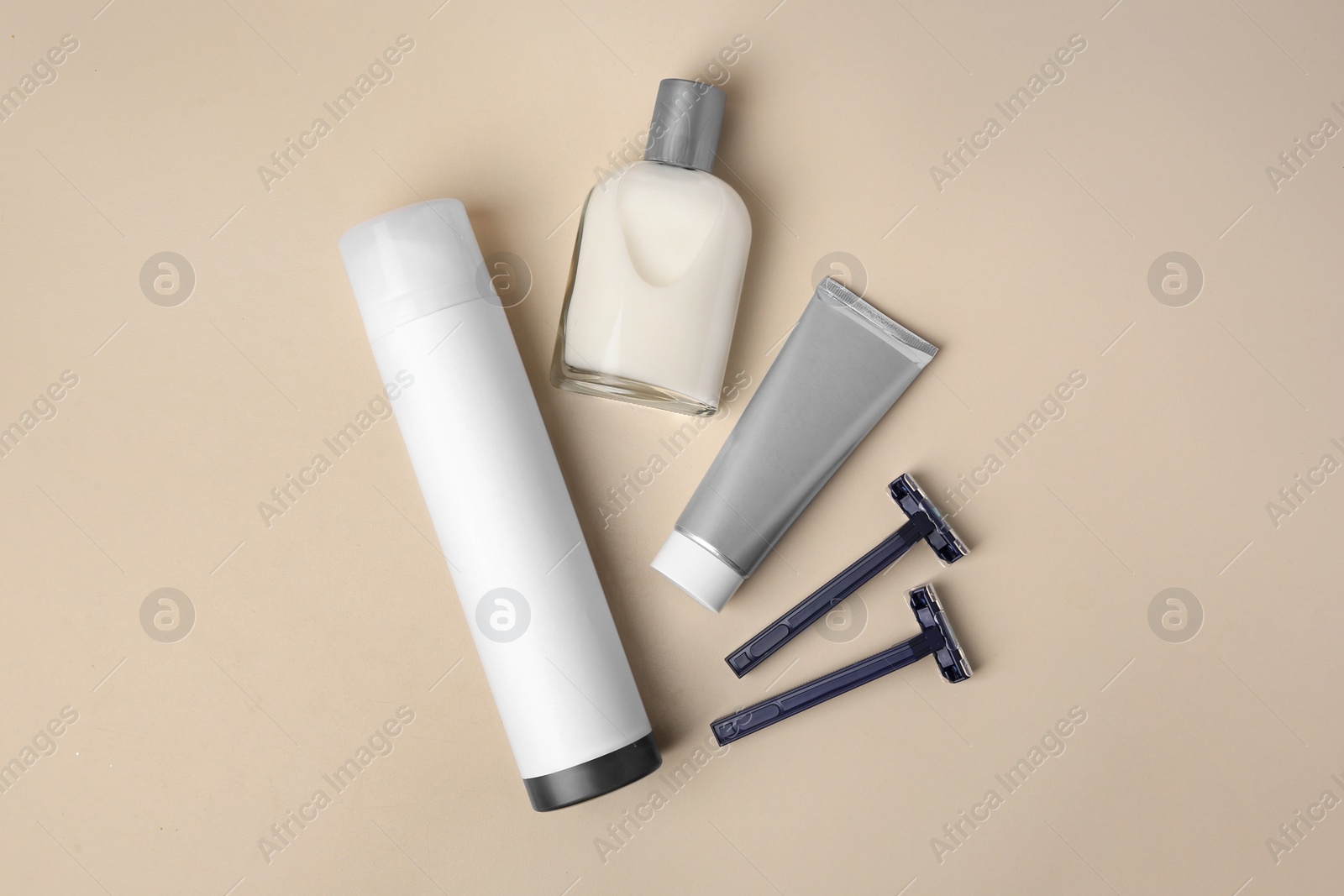 Photo of Flat lay composition with shaving accessories for men on beige background