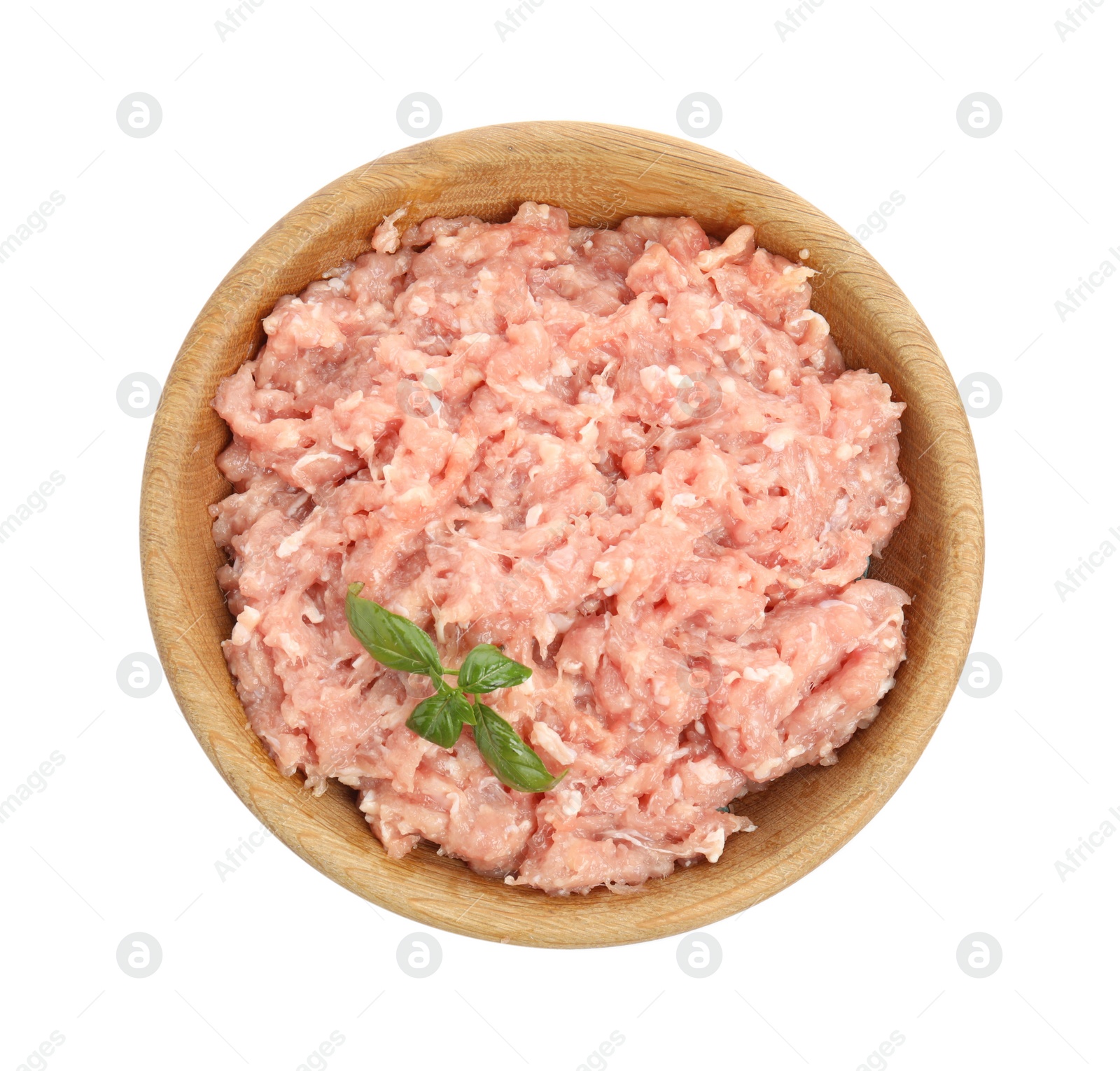 Photo of Raw chicken minced meat with basil in bowl on white background, top view