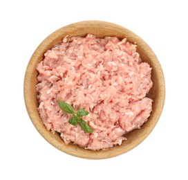 Raw chicken minced meat with basil in bowl on white background, top view