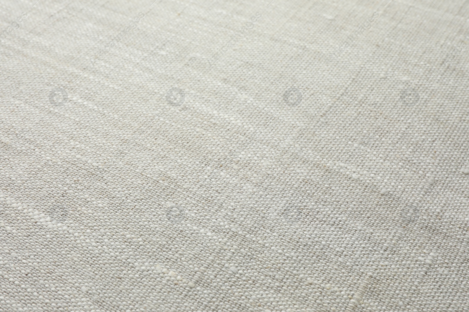 Photo of Texture of light grey fabric as background, closeup