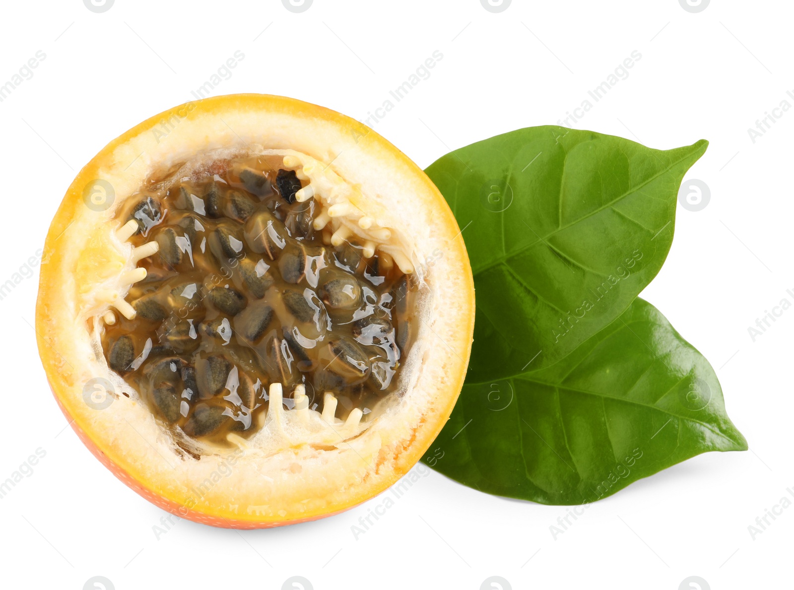 Photo of Half of delicious granadilla with leaves isolated on white