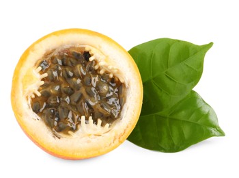 Photo of Half of delicious granadilla with leaves isolated on white