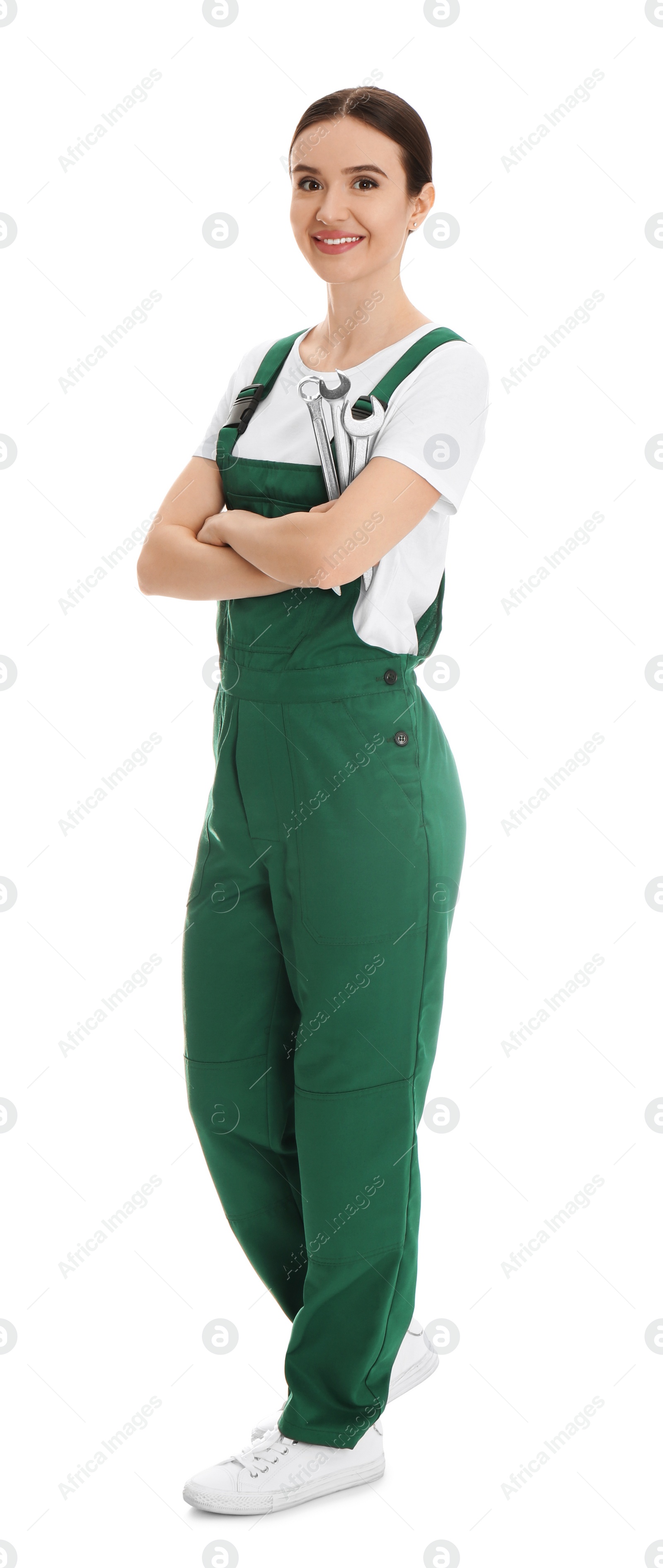 Photo of Full length portrait of professional auto mechanic with wrenches on white background