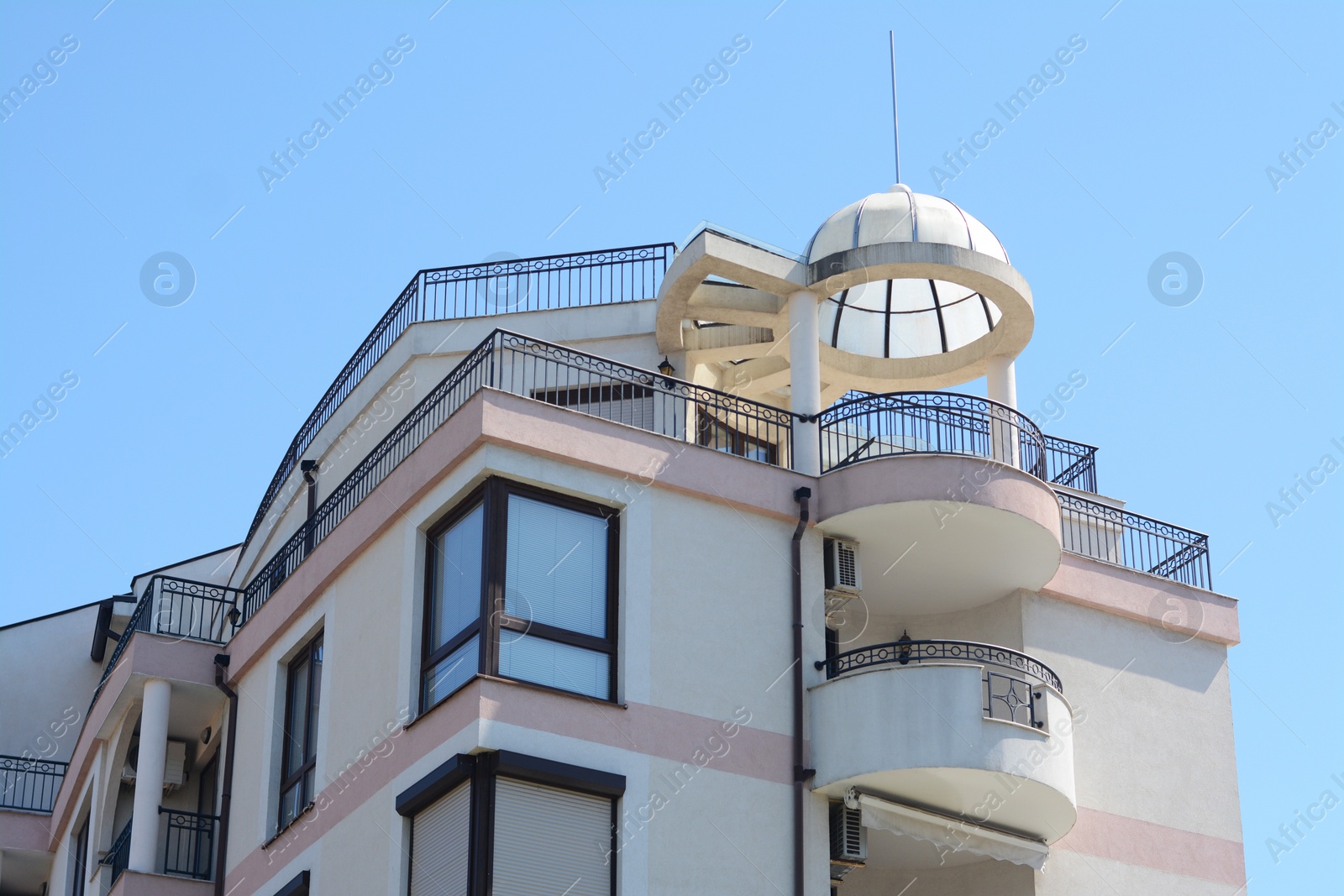 Photo of Exterior of beautiful residential building against blue sky