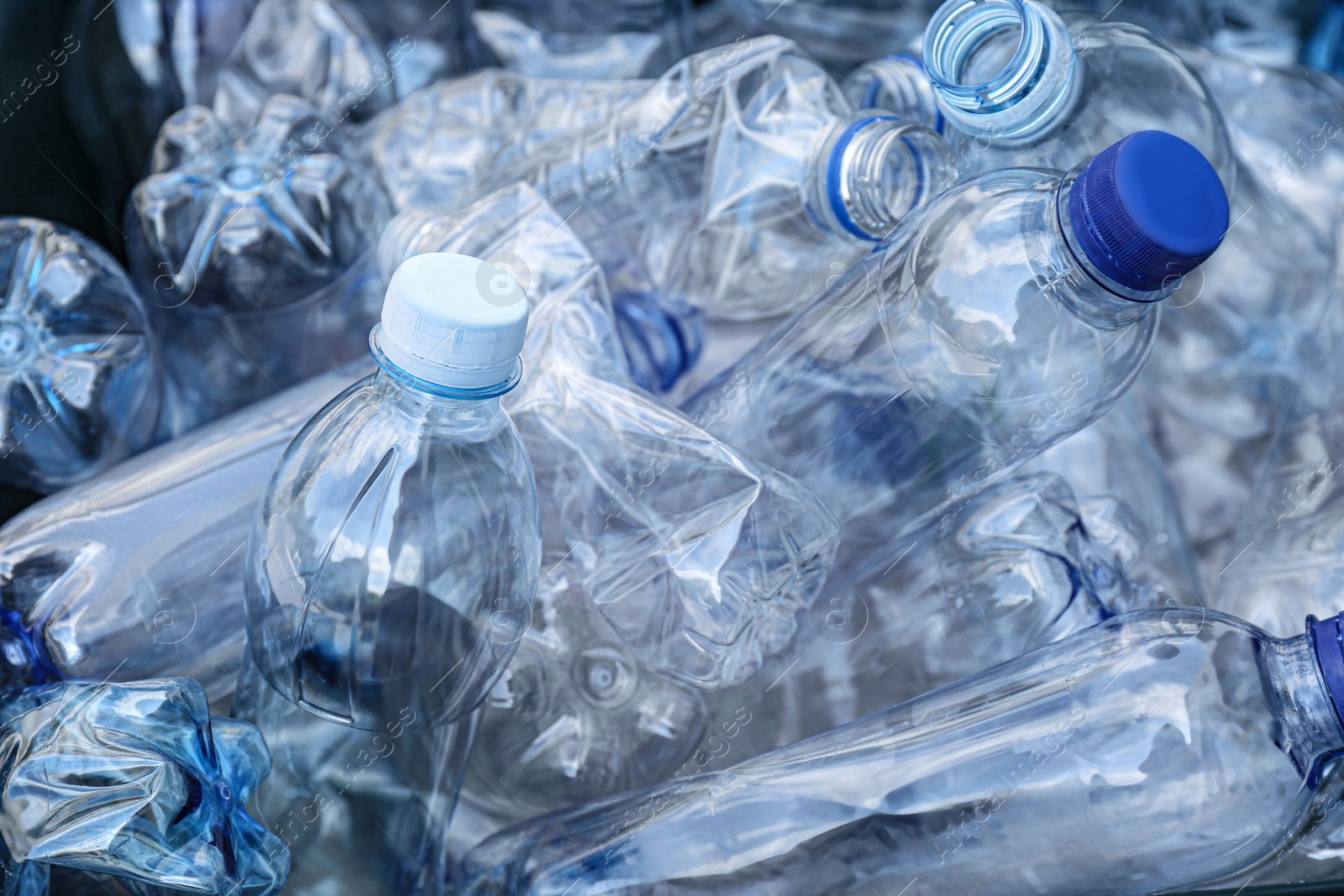 Photo of Pile of used plastic bottles as background, closeup. Recycling problem