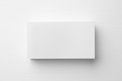 Photo of Stackblank business cards on white table, top view. Mockup for design