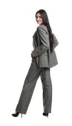 Photo of Full length portrait of beautiful woman in formal suit on white background. Business attire