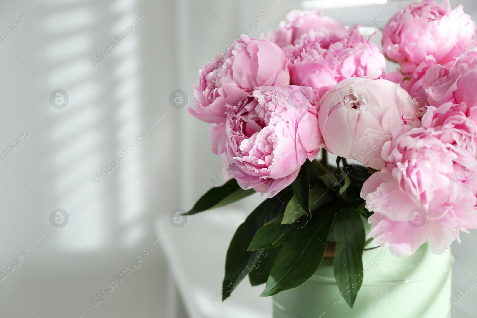Photo of Bouquet of beautiful pink peonies indoors, closeup. Space for text