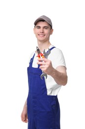 Photo of Young man holding pliers on white background