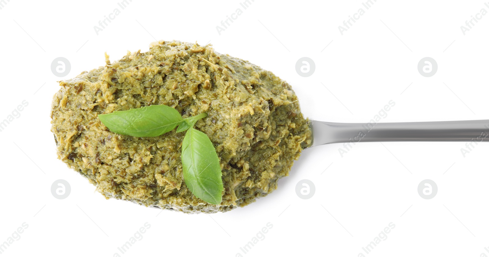 Photo of Spoon with delicious pesto sauce and basil isolated on white, top view