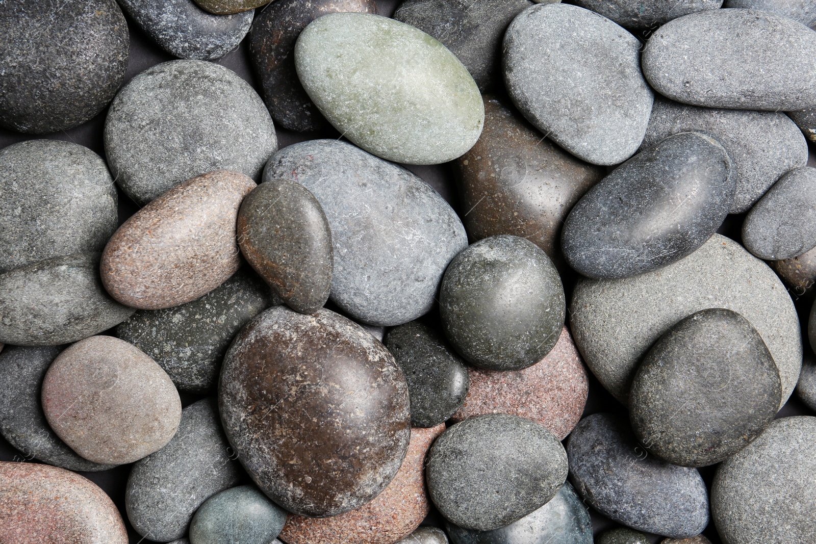 Photo of Composition with spa stones as background, top view