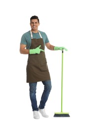 Man with green broom on white background