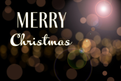 Image of Blurred view of beautiful lights and phrase Merry Christmas. Holiday greeting card design 