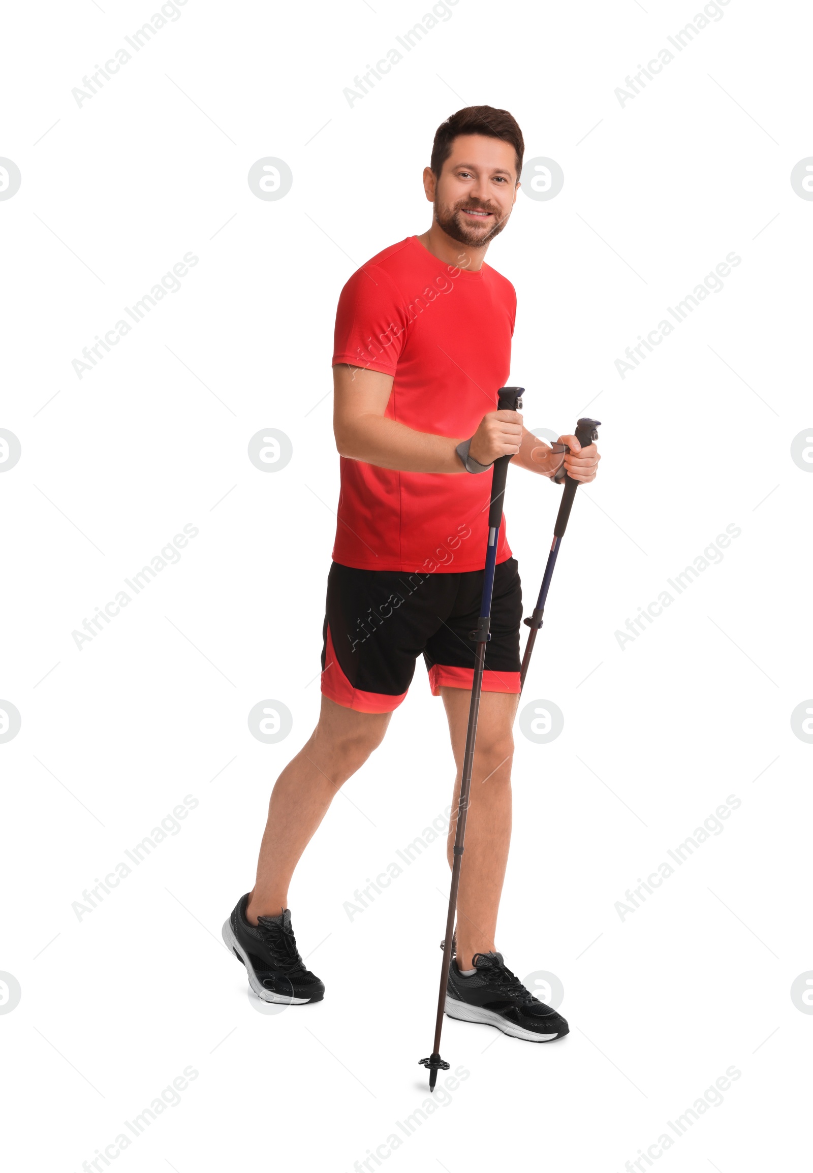 Photo of Man practicing Nordic walking with poles isolated on white