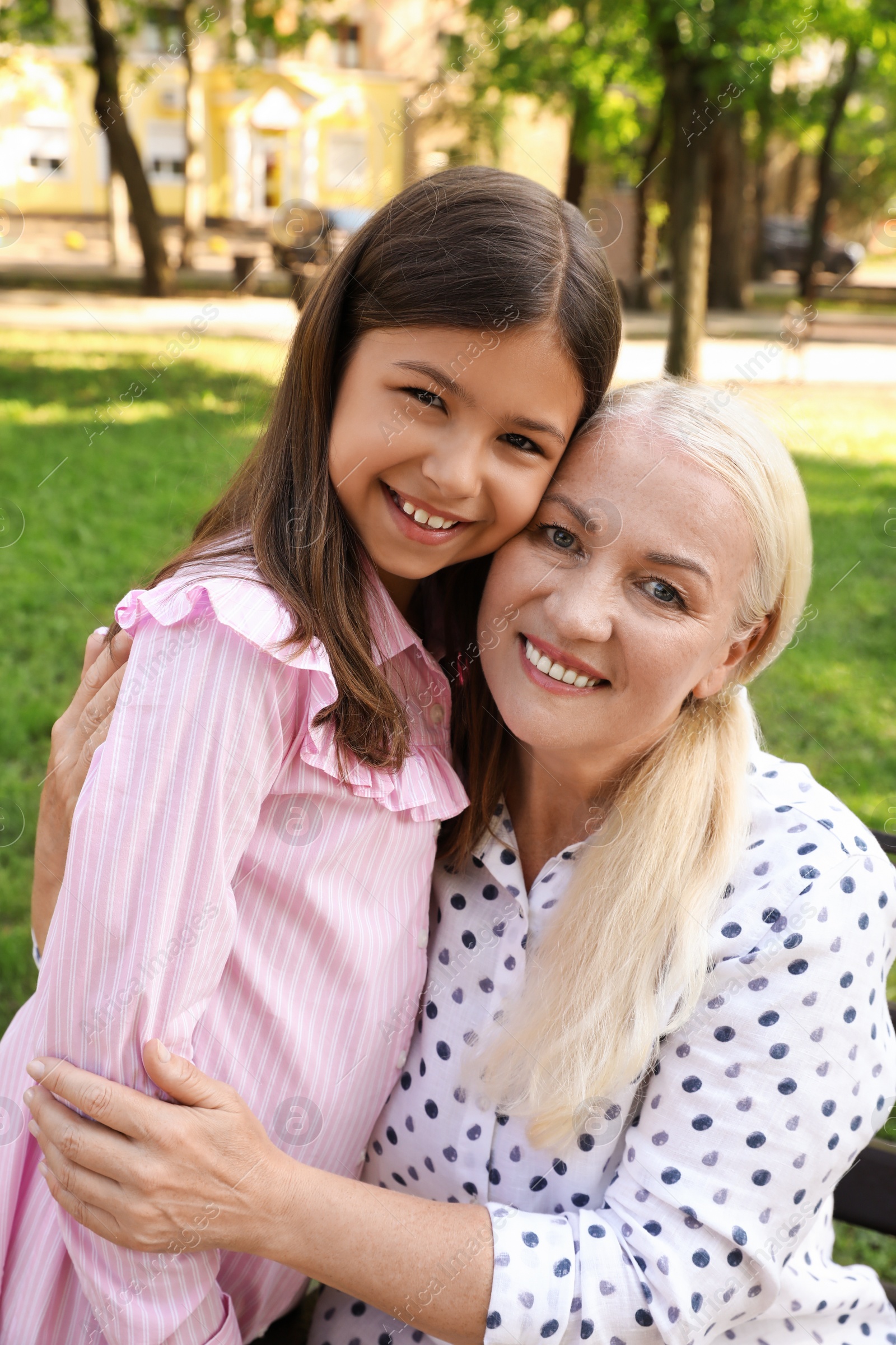 Photo of Mature woman with her little granddaughter in park