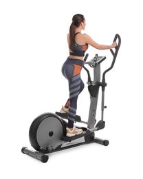 Woman using modern elliptical machine on white background