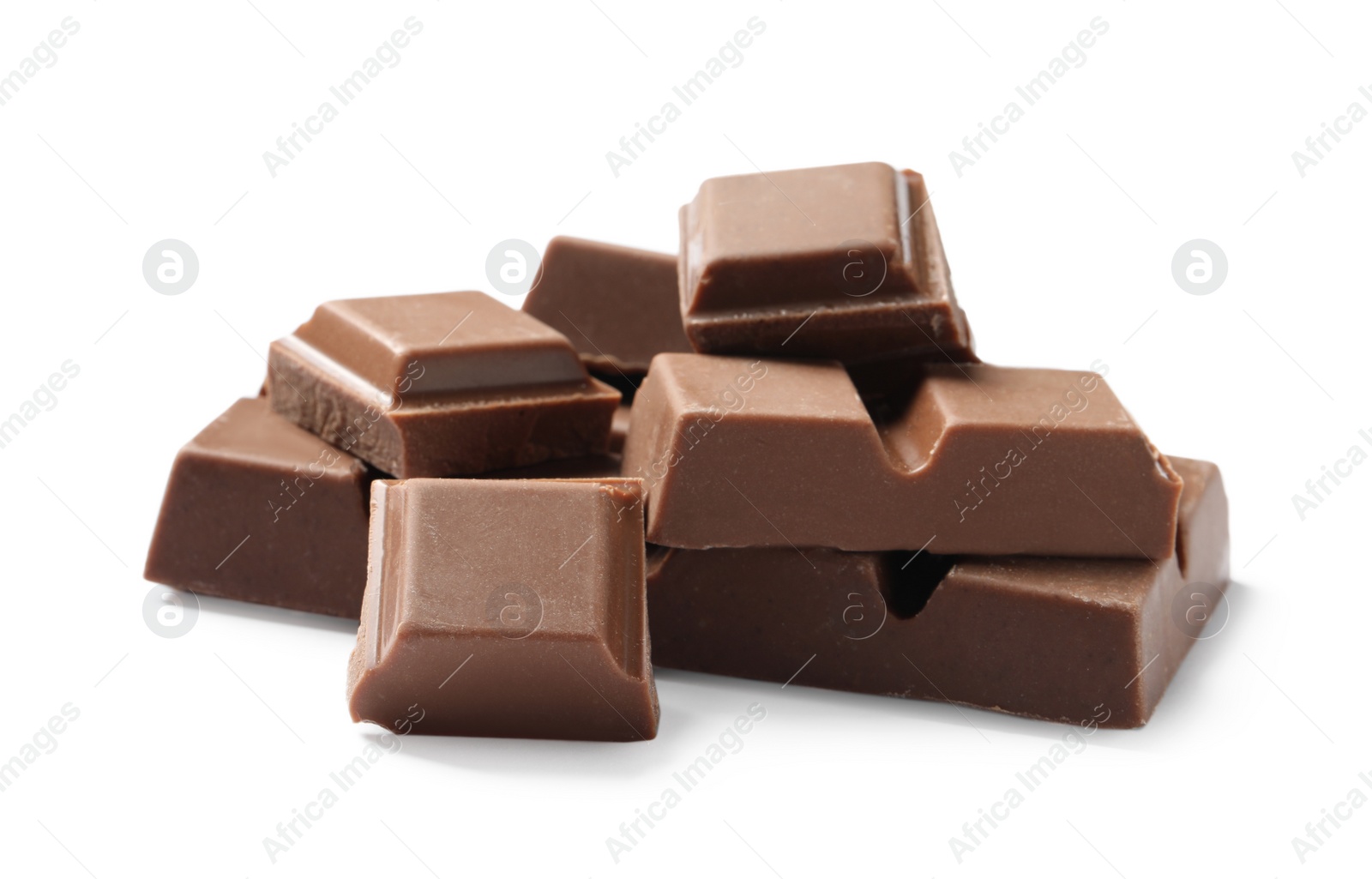 Photo of Pieces of delicious milk chocolate isolated on white