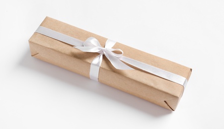 Photo of Beautifully wrapped gift box on white background