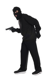 Thief in balaclava with gun sneaking on white background