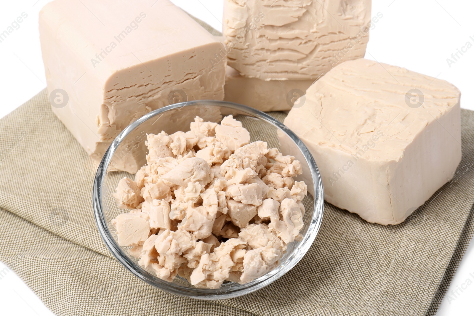 Photo of Pieces of compressed yeast on white background