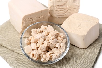 Pieces of compressed yeast on white background