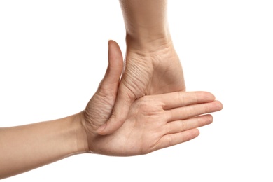 Photo of Woman showing hand sign on white background, closeup. Body language