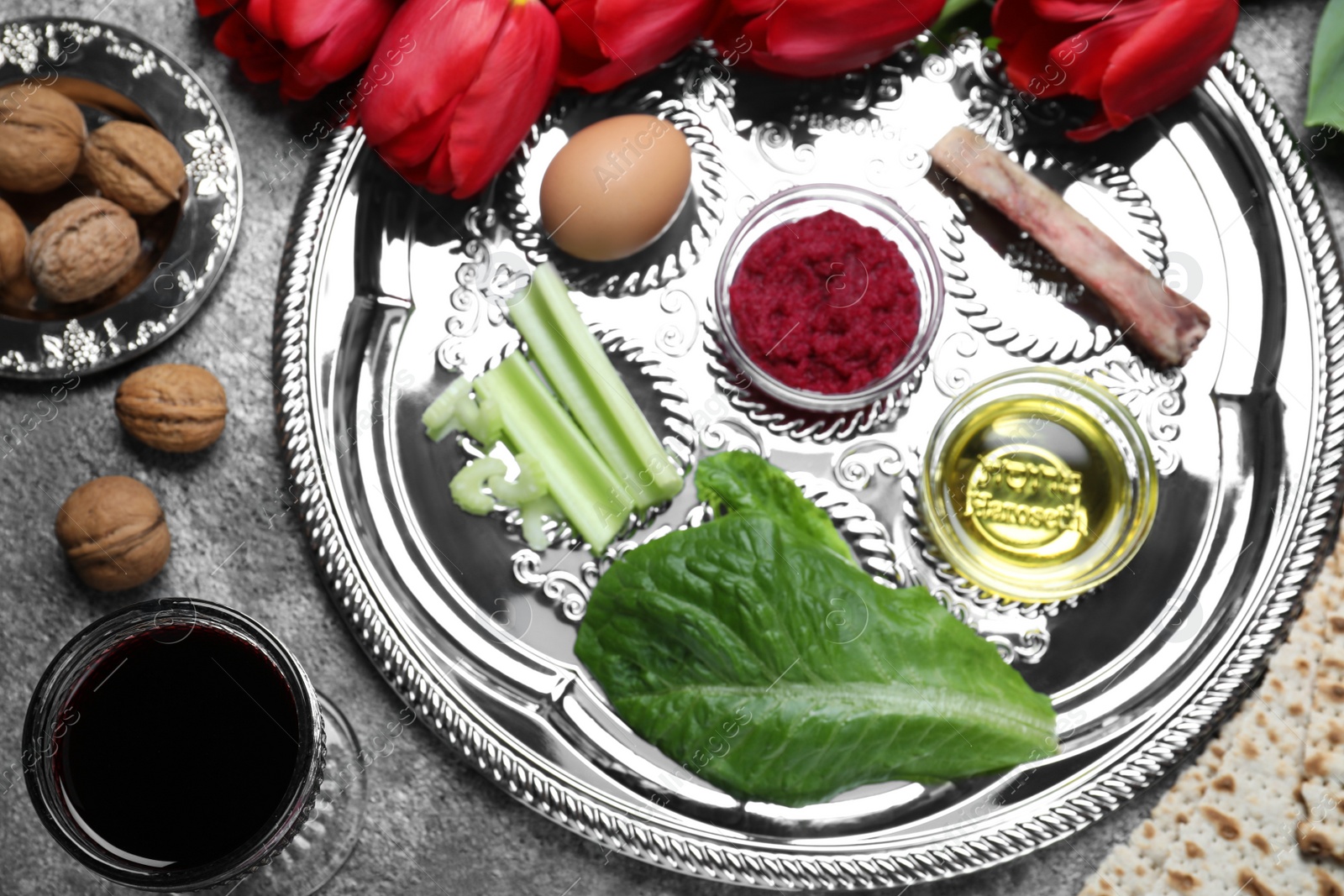 Photo of Flat lay composition with Passover Seder plate (keara) on grey table. Pesah celebration