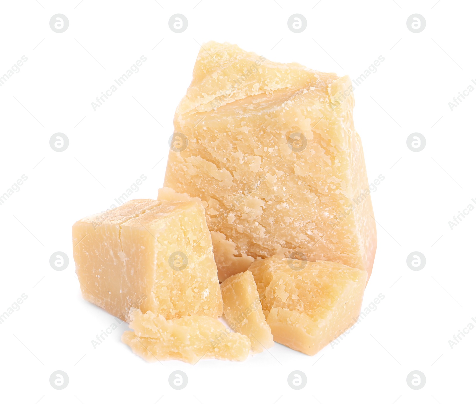 Photo of Pieces of delicious parmesan cheese on white background