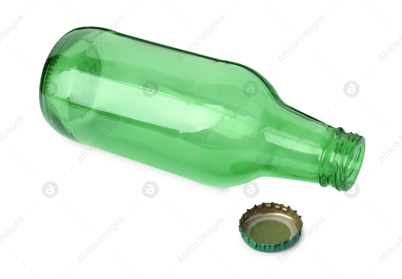 Photo of One empty green beer bottle and cap isolated on white