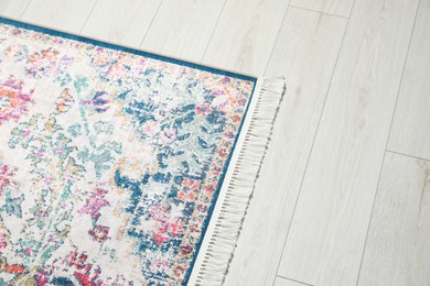 Photo of Carpet with beautiful pattern on floor, above view. Space for text