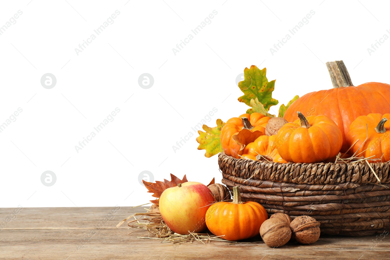 Photo of Composition with ripe pumpkins and autumn leaves on wooden table against white background. Happy Thanksgiving day