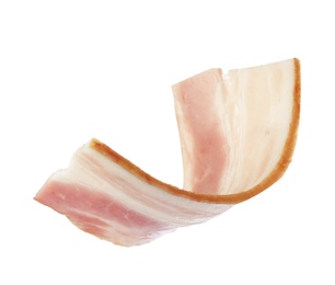 Cut fresh tasty bacon on white background