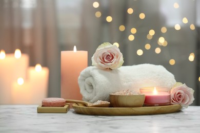 Photo of Beautiful composition with different spa products and rose flower on white marble table