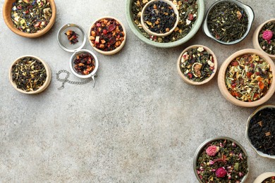 Photo of Many different herbal teas on grey table, flat lay. Space for text