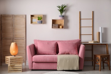 Photo of Modern living room interior with stylish pink sofa