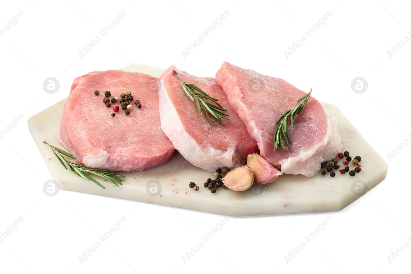 Photo of Board with pieces of raw pork meat and spices isolated on white