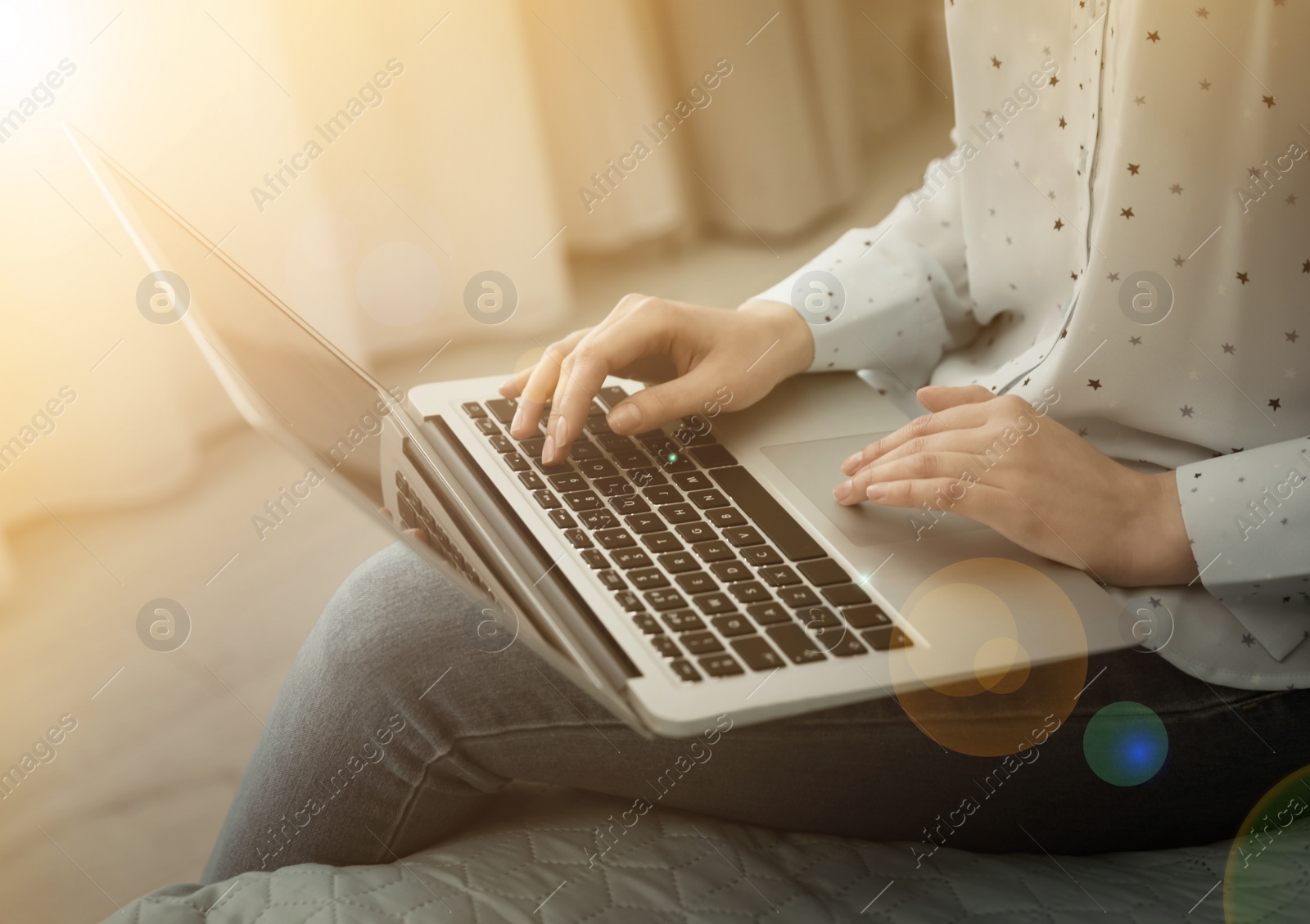 Image of Woman working with laptop at home, closeup