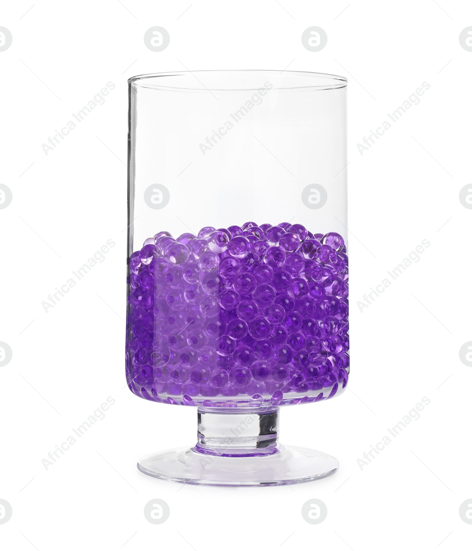 Photo of Violet filler in glass vase isolated on white. Water beads