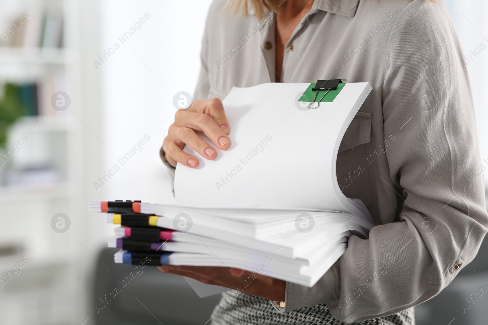 Photo of Businesswoman with documents in office, closeup view