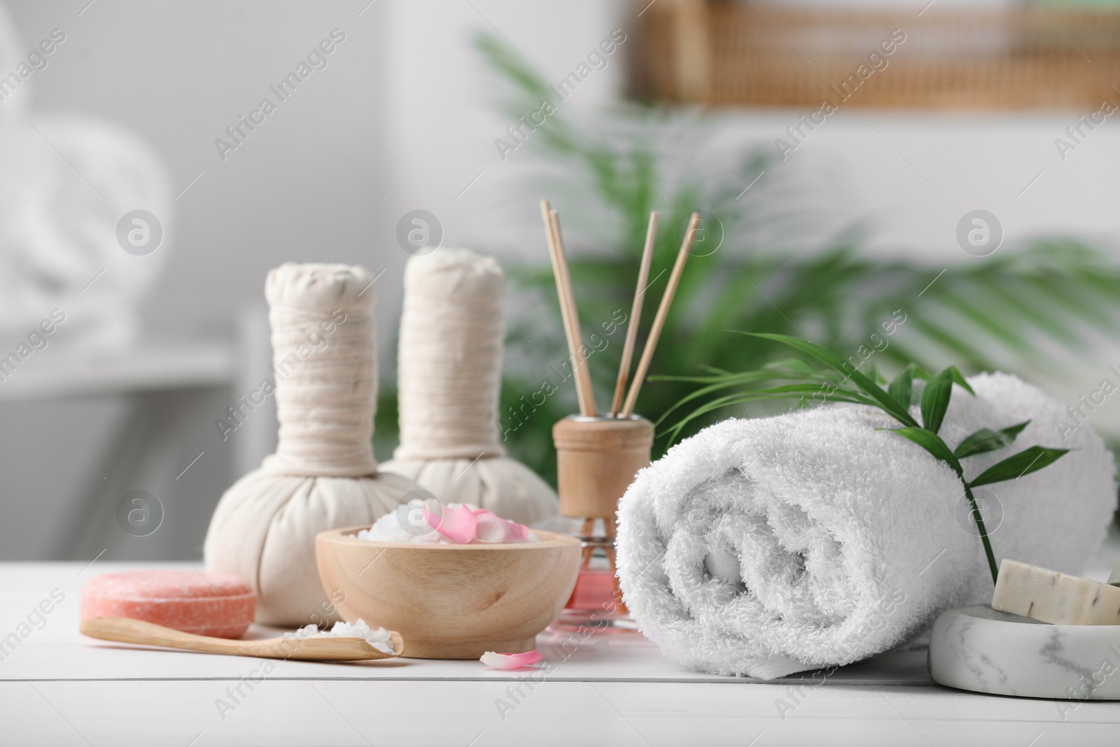 Photo of Beautiful composition with different spa products on white table against blurred background