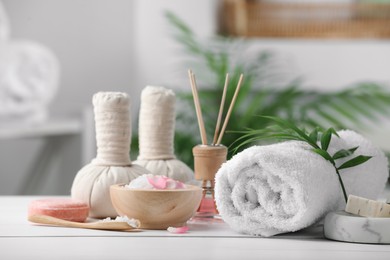 Photo of Beautiful composition with different spa products on white table against blurred background